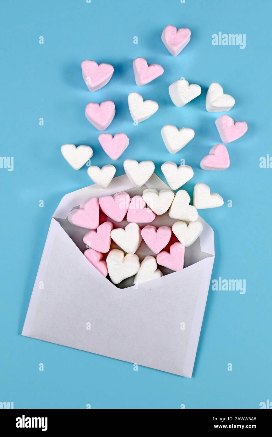 Pink heart shaped marshmallows on white background Stock Photo - Alamy