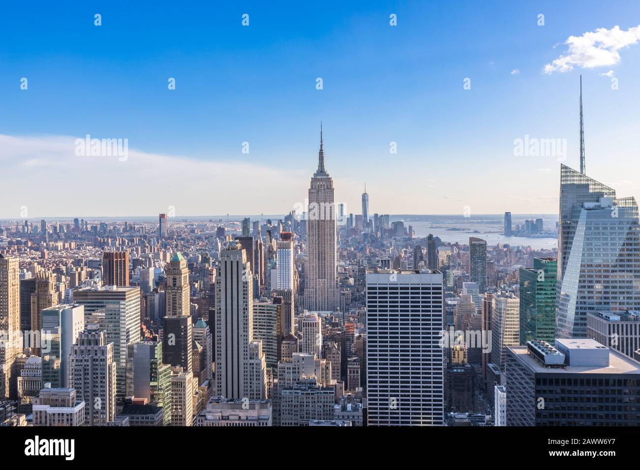 New York City Skyline in Manhattan downtown with Empire State Building and skyscrapers on sunny day with clear blue sky USA Stock Photo