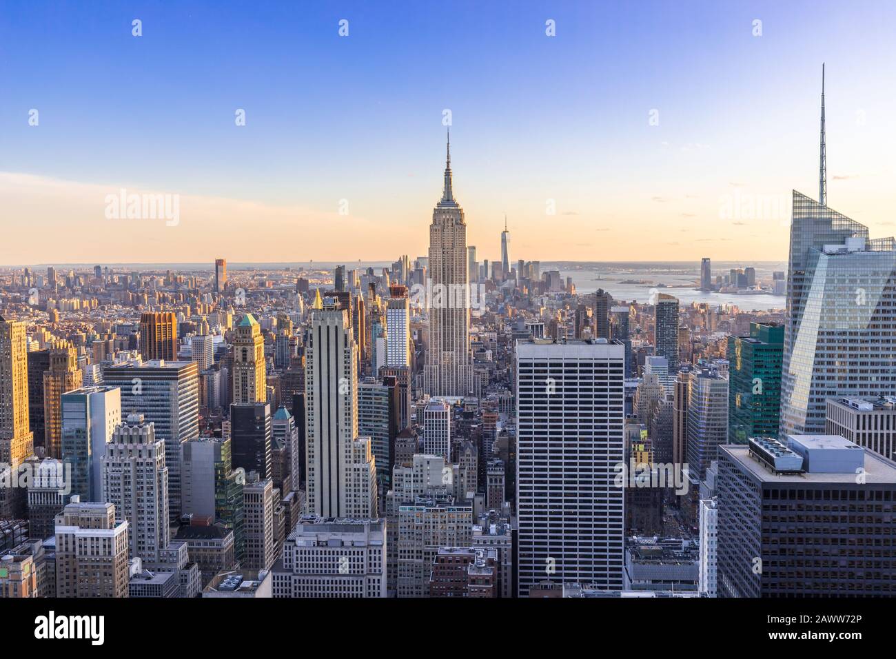 New York City Skyline in Manhattan downtown with Empire State Building and skyscrapers at sunset USA Stock Photo