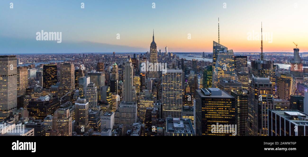 Panoramic photo of New York City Skyline in Manhattan downtown with Empire State Building and skyscrapers at night USA Stock Photo