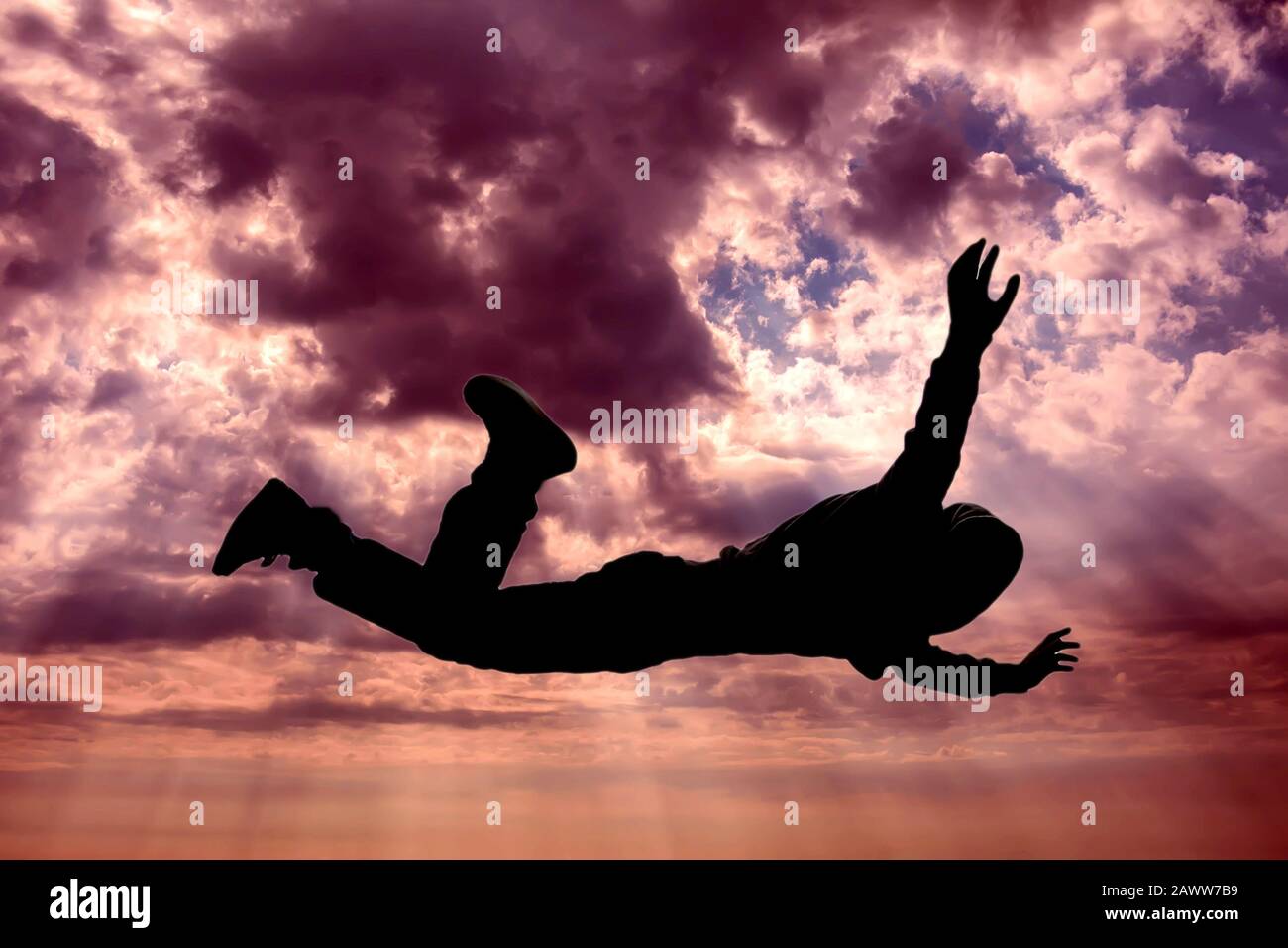 A silhouette of man flying in the sky. Afterlife, mystery and dream concept Stock Photo