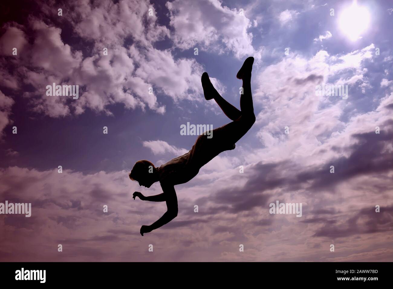 A silhouette of woman flying in the sky. Afterlife, mystery and dream concept Stock Photo