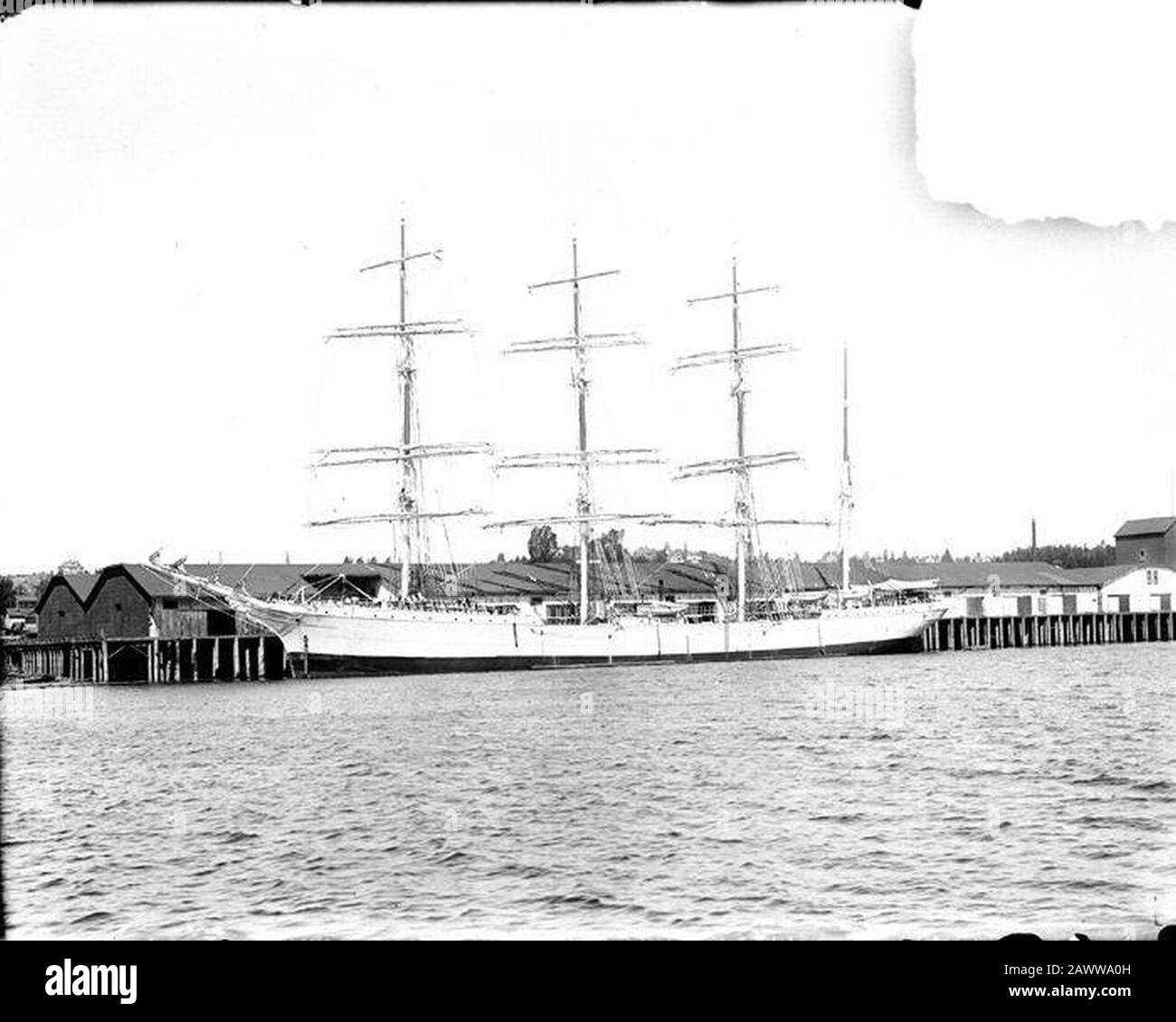 Four-masted square-rigger tied up at wharf location unknown ca 1900 ...