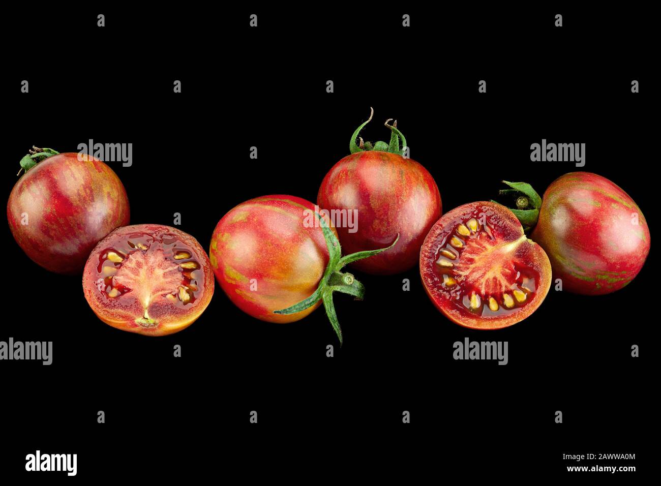 Brown cherry tomatoes colseup isolated on black background Stock Photo ...