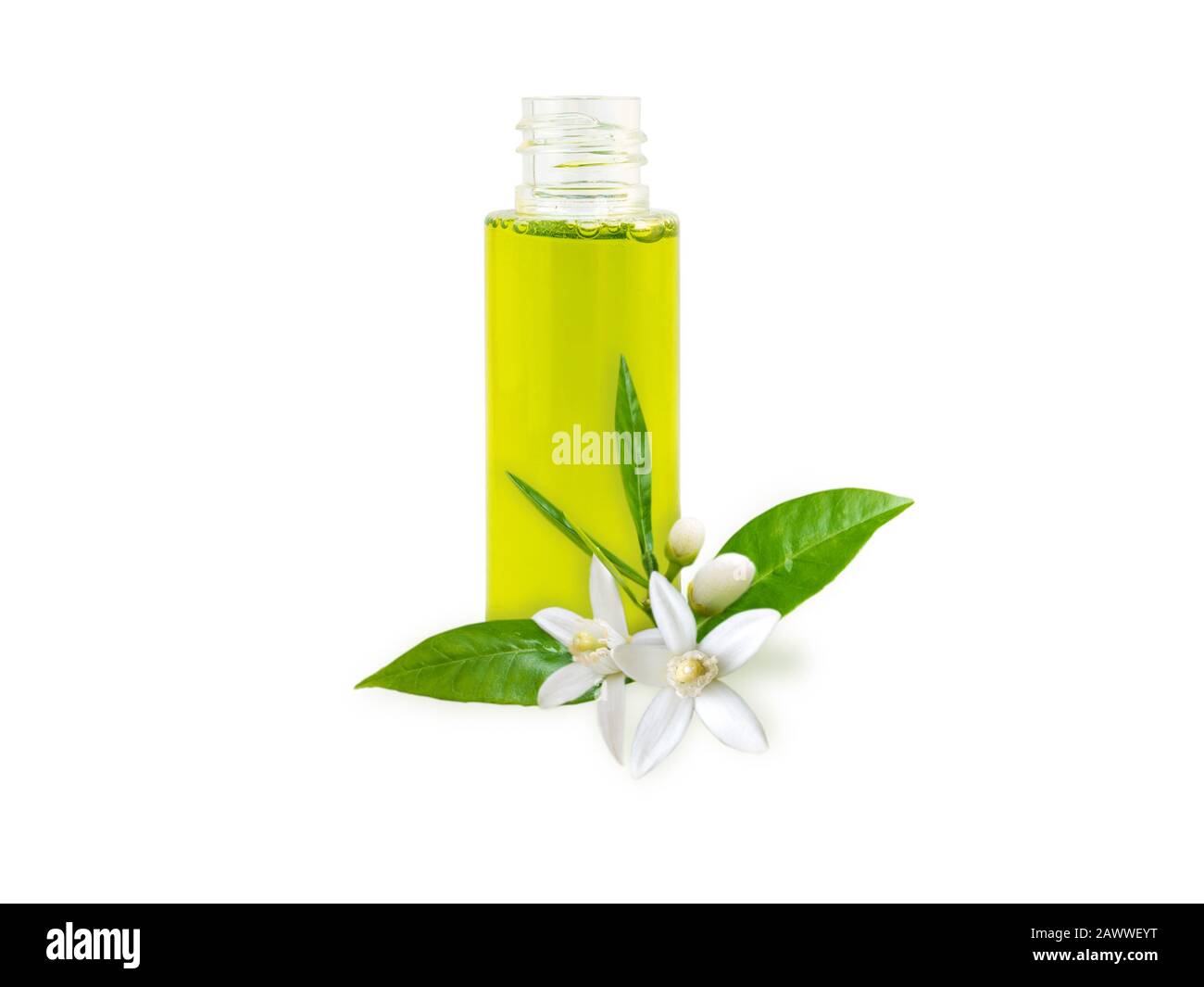 Neroli essential oil in the bottle and orange tree fragrant flowers, leaves and buds isolated on white. Stock Photo