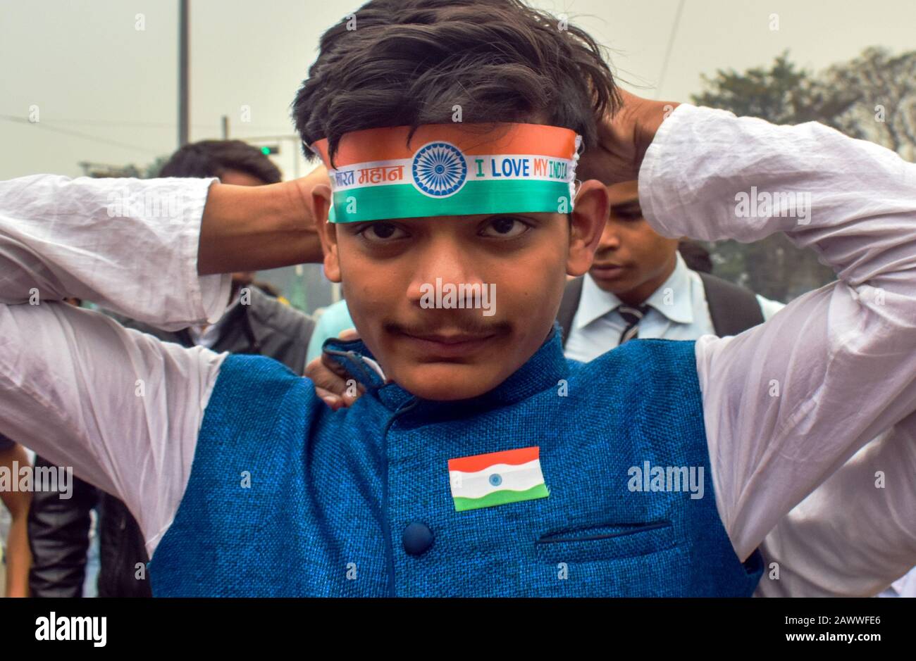 A Boy is wearing an Indian flag ribbon on his head in an NRC protest rally at Kolkata, India. Stock Photo