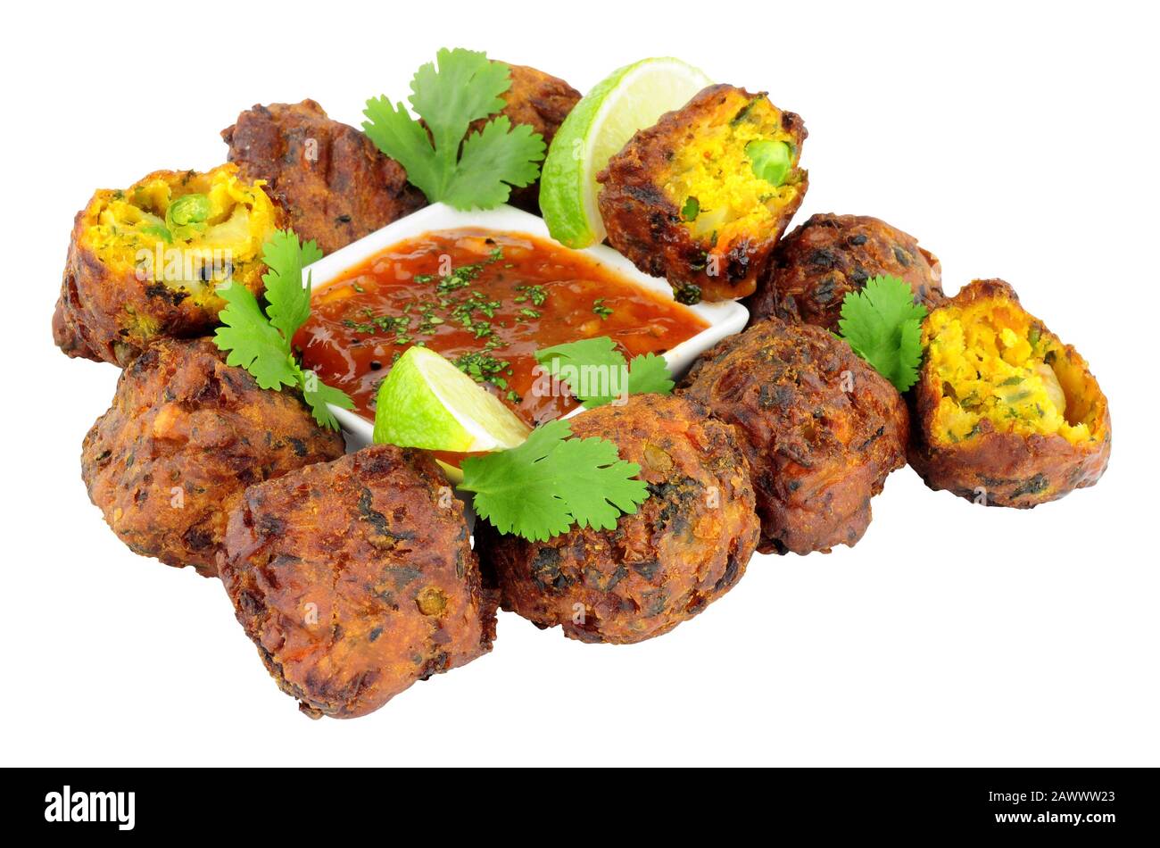 Group of fried vegetable pakora with chilli sauce dip isolated on a white background Stock Photo