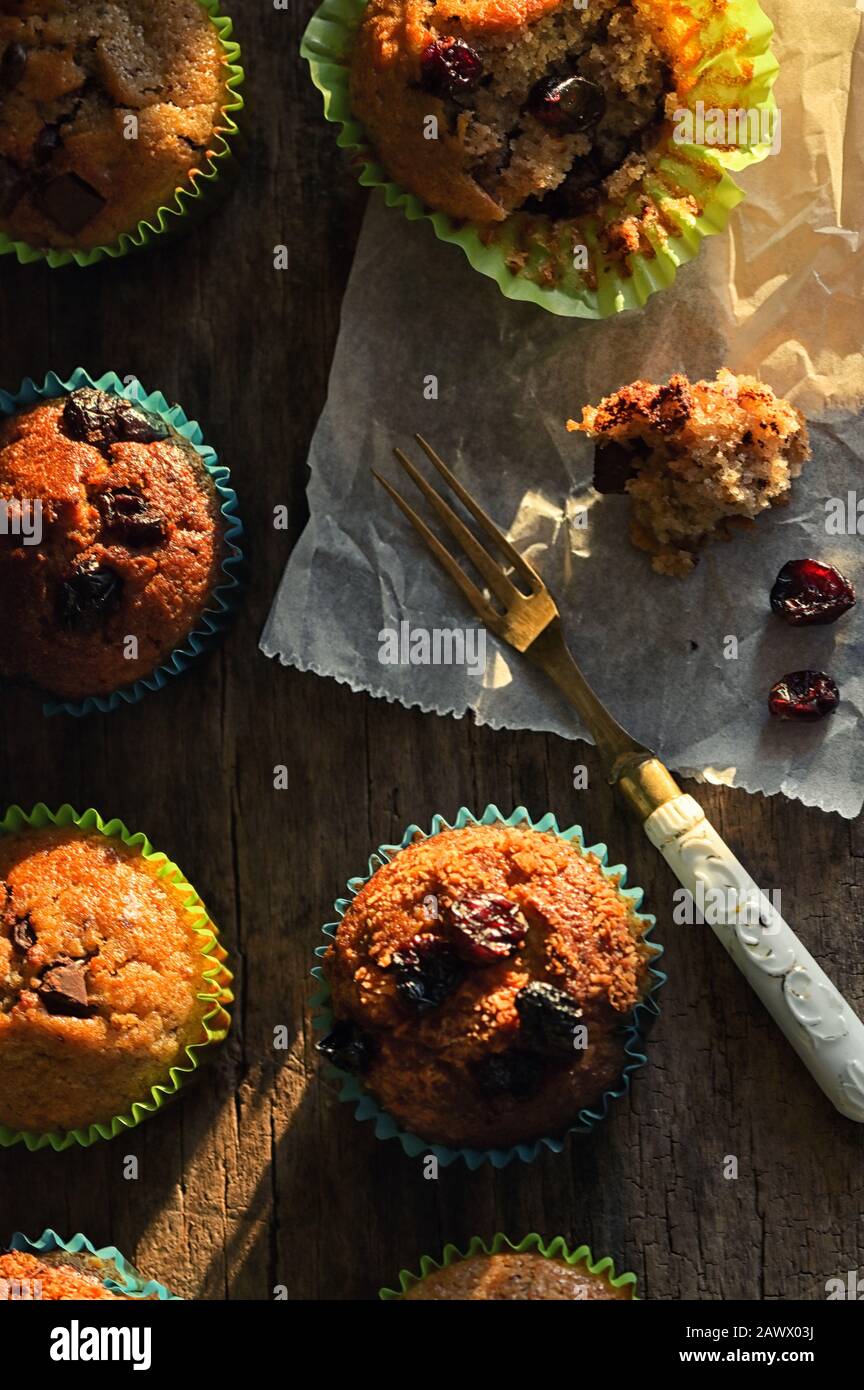 Fresh Muffins with Chocolate or Fruits on Wooden Stock Photo