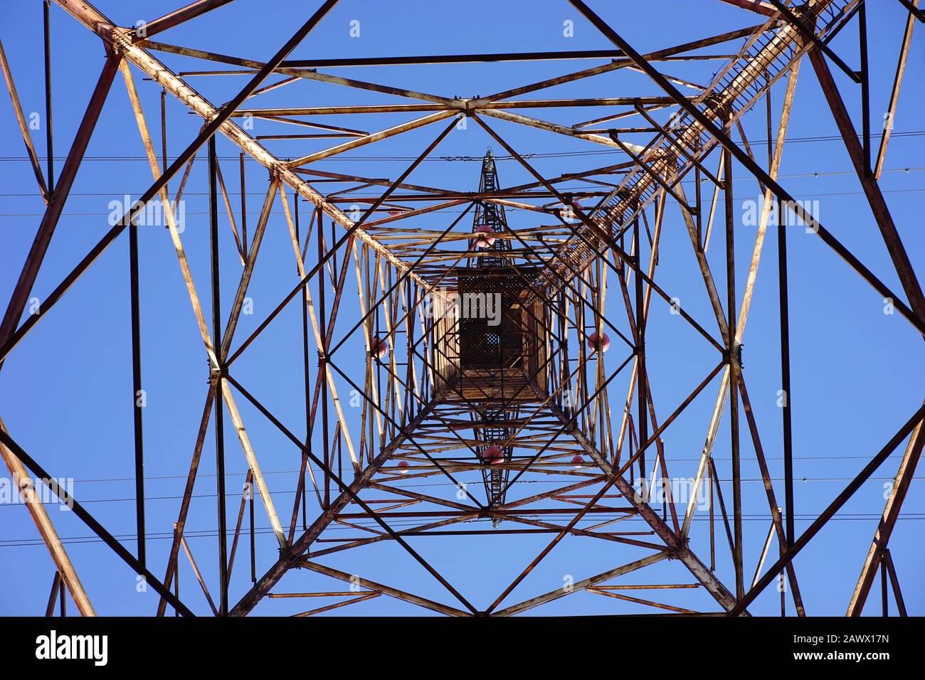 Electric pole with blue sky as background Stock Photo - Alamy