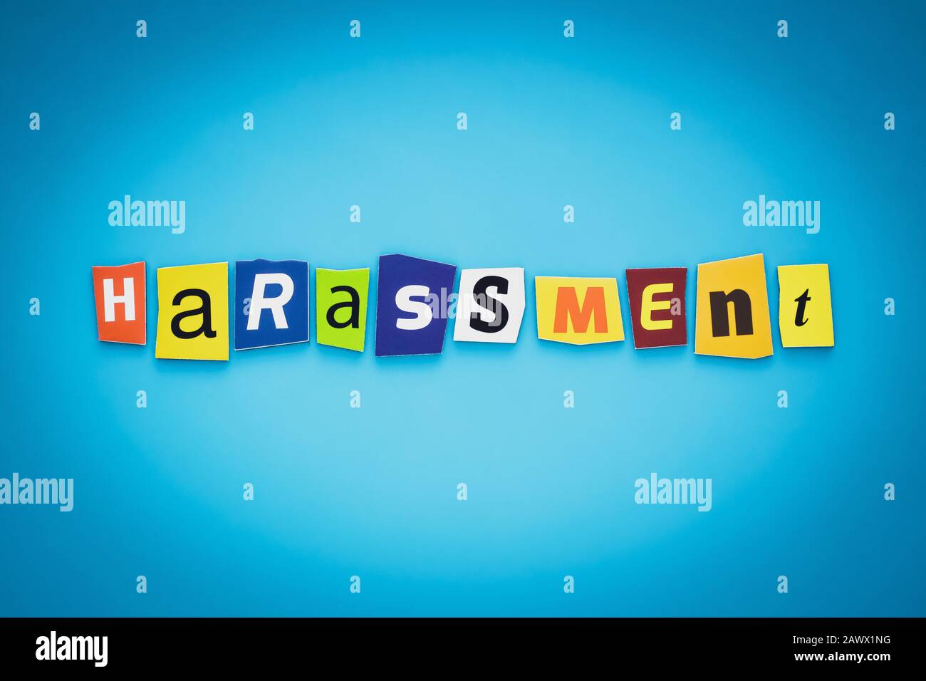 Text - Harassment from newspaper colorful letters on blue background. Single word, graphic banner. Header concept Stock Photo