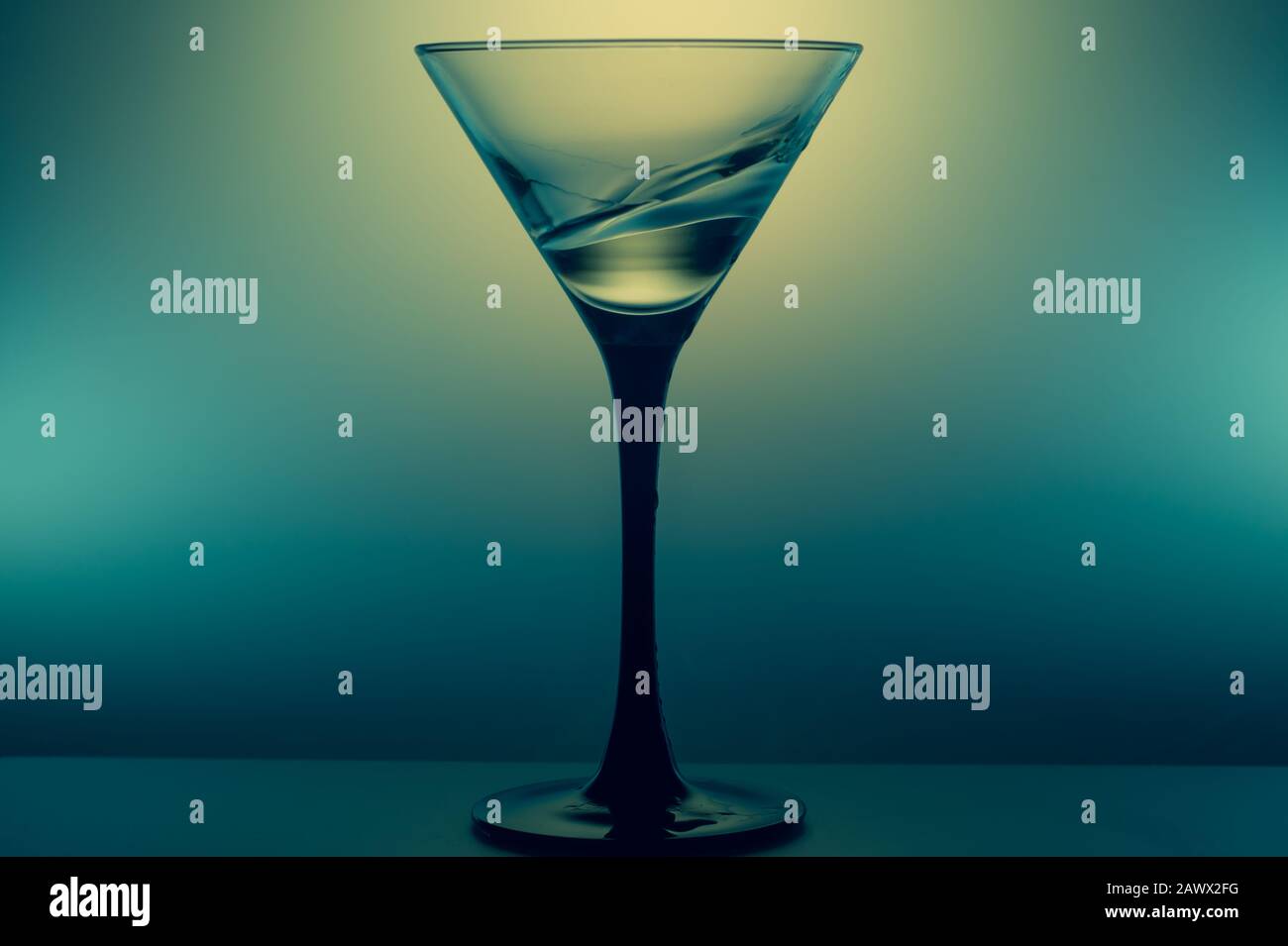 https://c8.alamy.com/comp/2AWX2FG/martini-glass-with-water-splash-on-glowing-background-transparent-cocktail-2AWX2FG.jpg