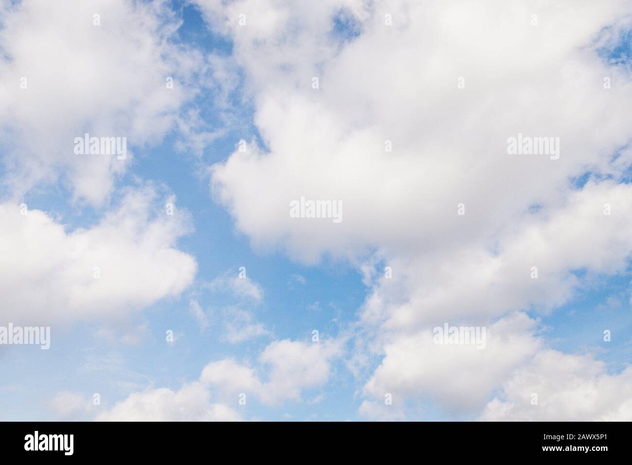 Beautiful blue sky with fluffy white clouds Stock Photo - Alamy