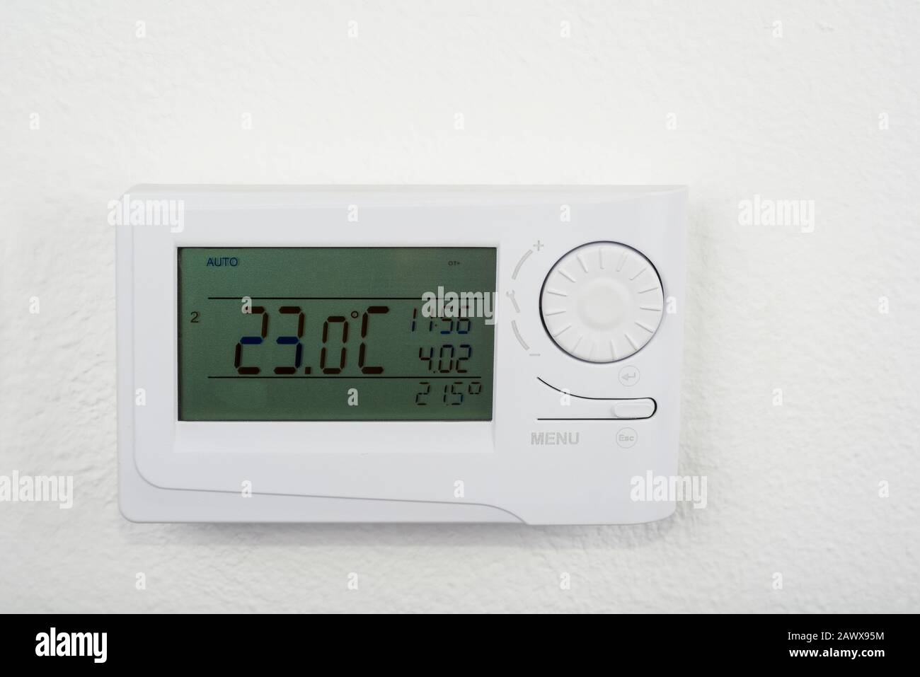 Modern heat thermostat on a white background Stock Photo - Alamy