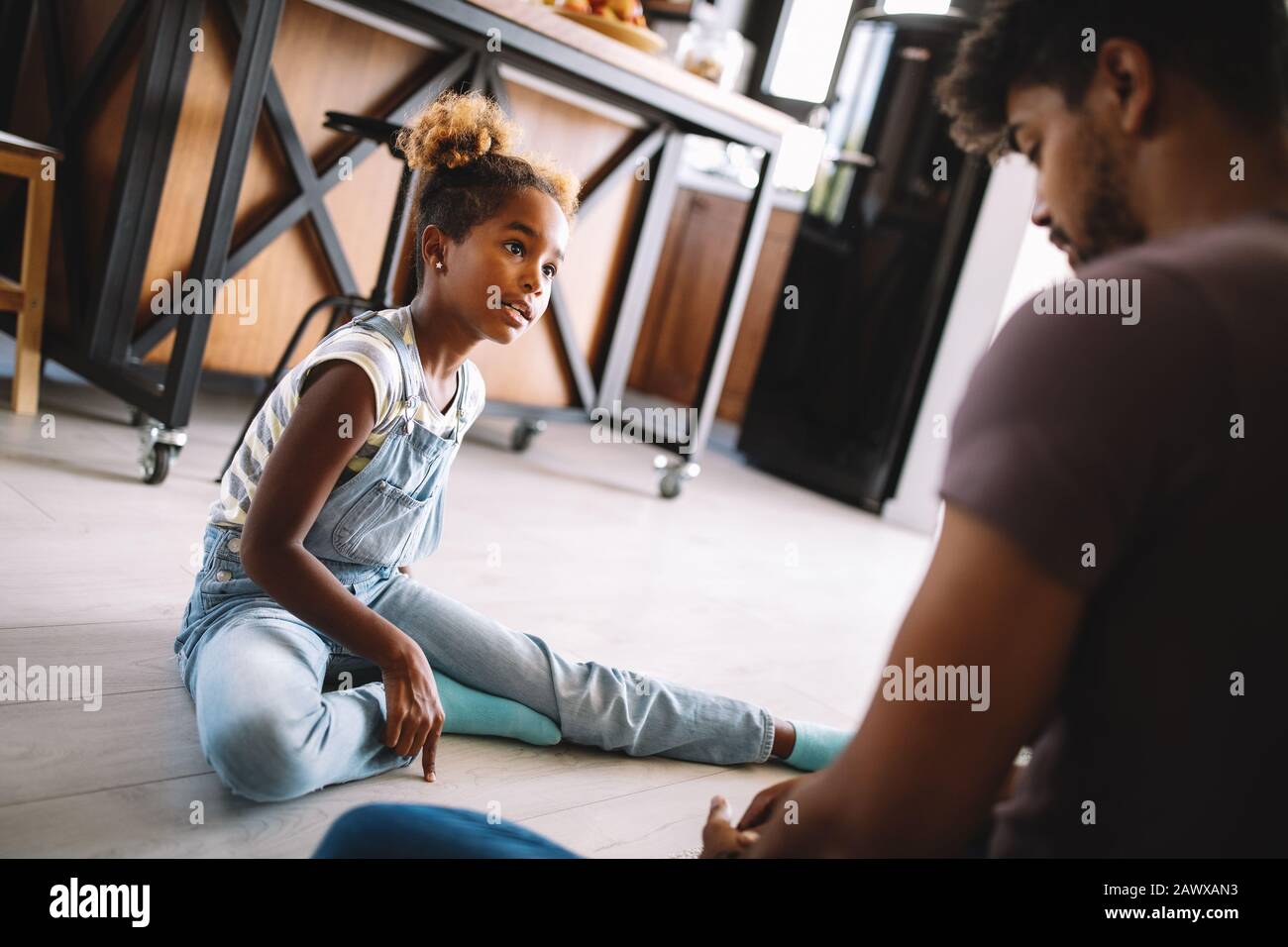 Parents having serious conversation with teenage child with problem solving attitude Stock Photo