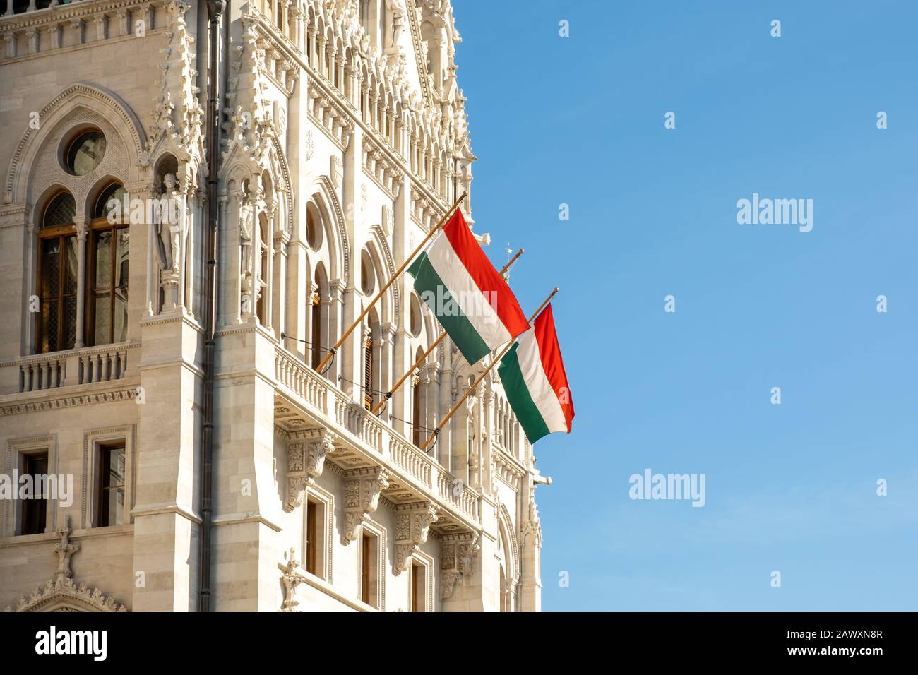Hungarian flags on the Hungarian Parliament Building or Parliament of Budapest, a landmark and popular tourist destination in Budapest, Hungary Stock Photo
