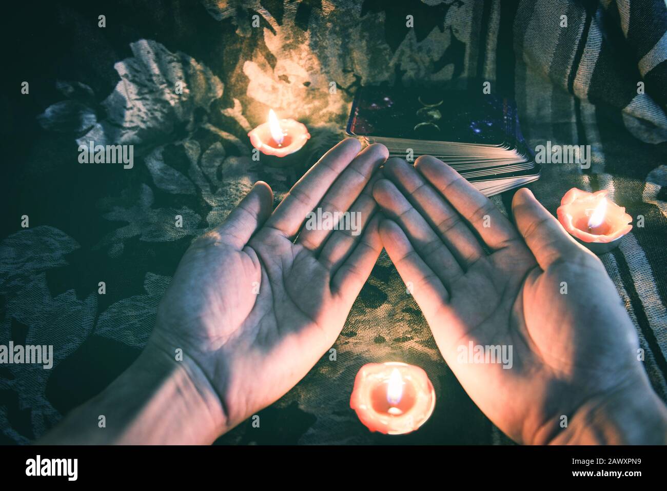 Fortune teller reading fortune lines on hand Palmistry Psychic readings