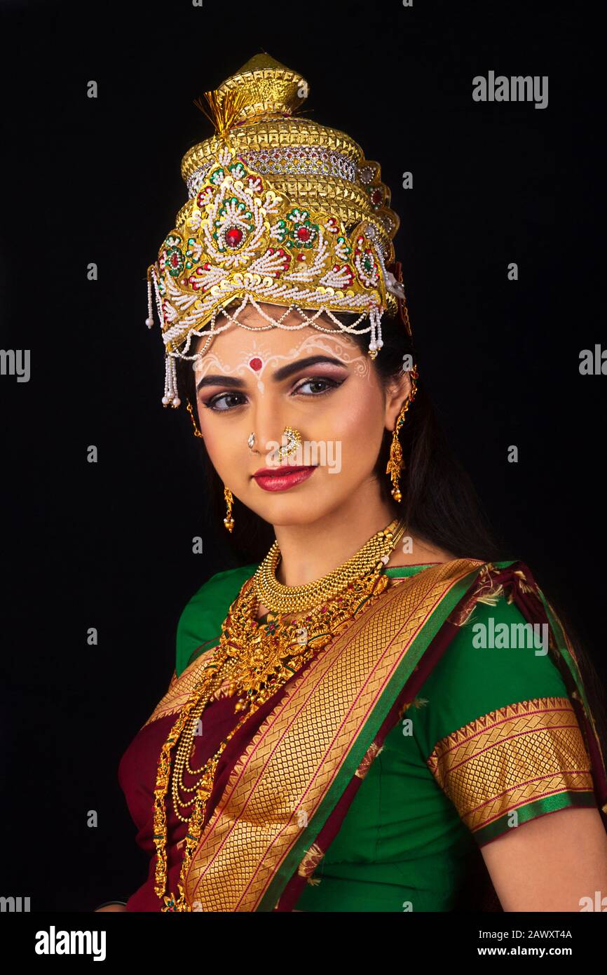 Indian model dressed like Goddess Laxmi in traditional saree, Jewel