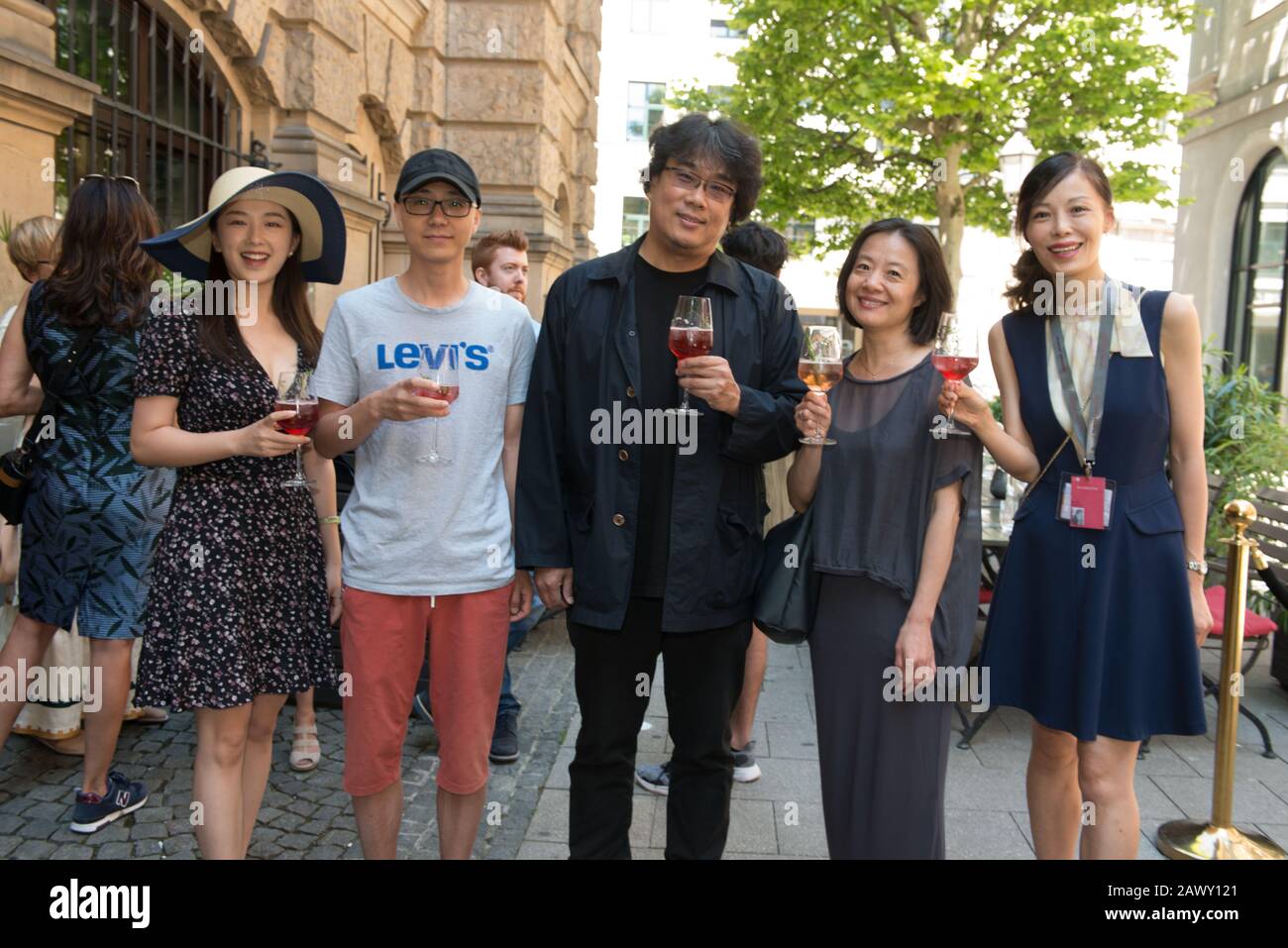 Oscar winning director Bong Joon Ho seen at the lunchbox reception of Filmfest München in July 2019 with Elena Diesbach, Stock Photo