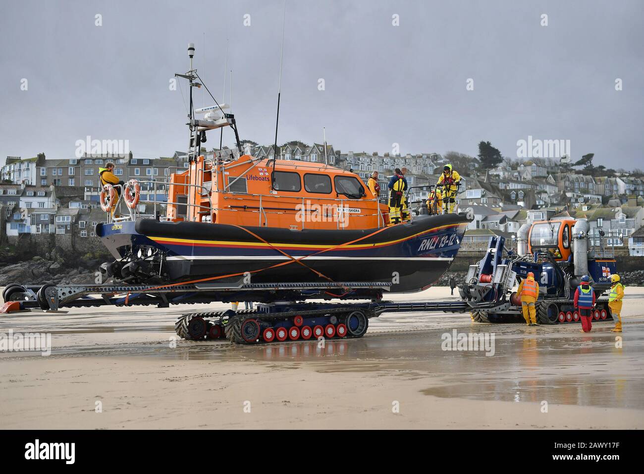 An RNLI boat is brought ashore at St Ives, The Met Office have said that 'a spell of very strong winds,' with gusts of 60-70mph, is expected across southern England on Monday, bringing likely delays to road, rail, air and ferry transport. Stock Photo