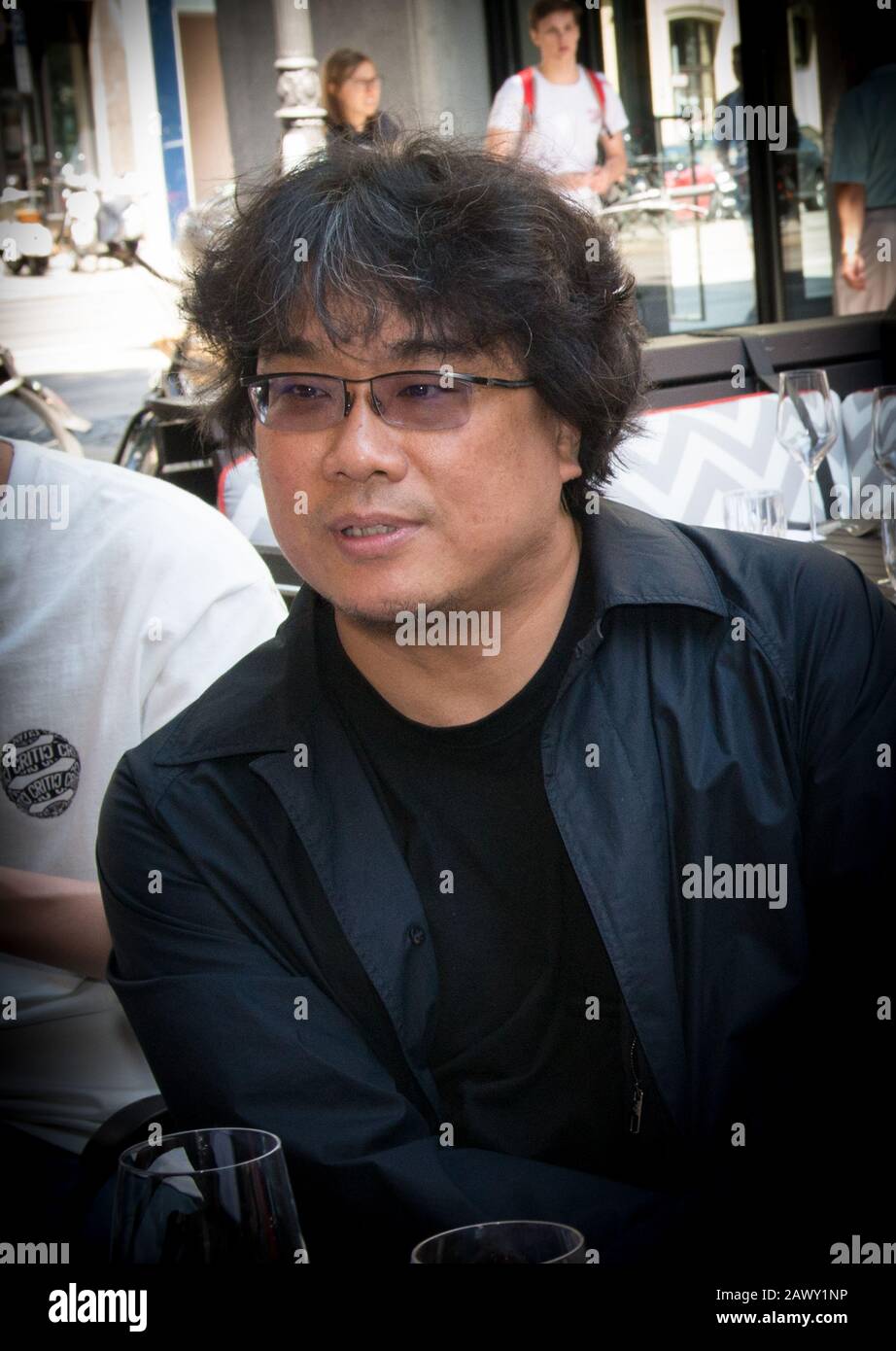 Oscar winning director Bong Joon Ho seen at the lunchbox reception of Filmfest München in July 2019 with Elena Diesbach, Stock Photo