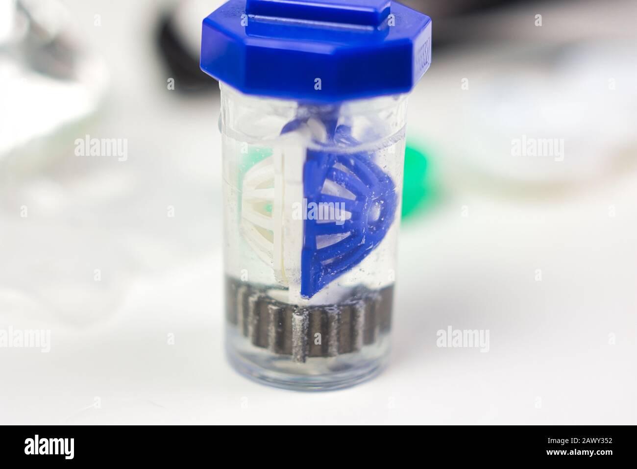 Blue contact lens case with bubbles from peroxide solution. Clean and