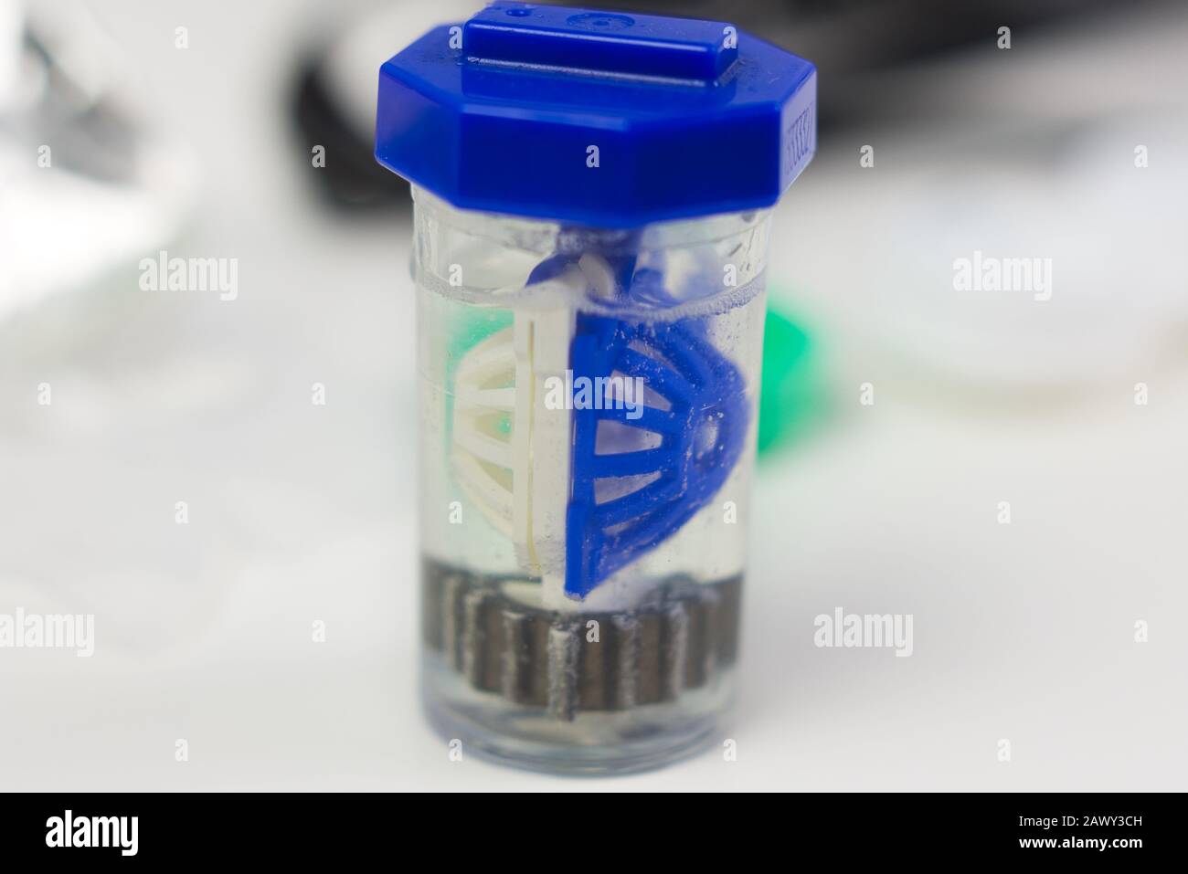 Blue contact lens case with bubbles from peroxide solution. Clean and