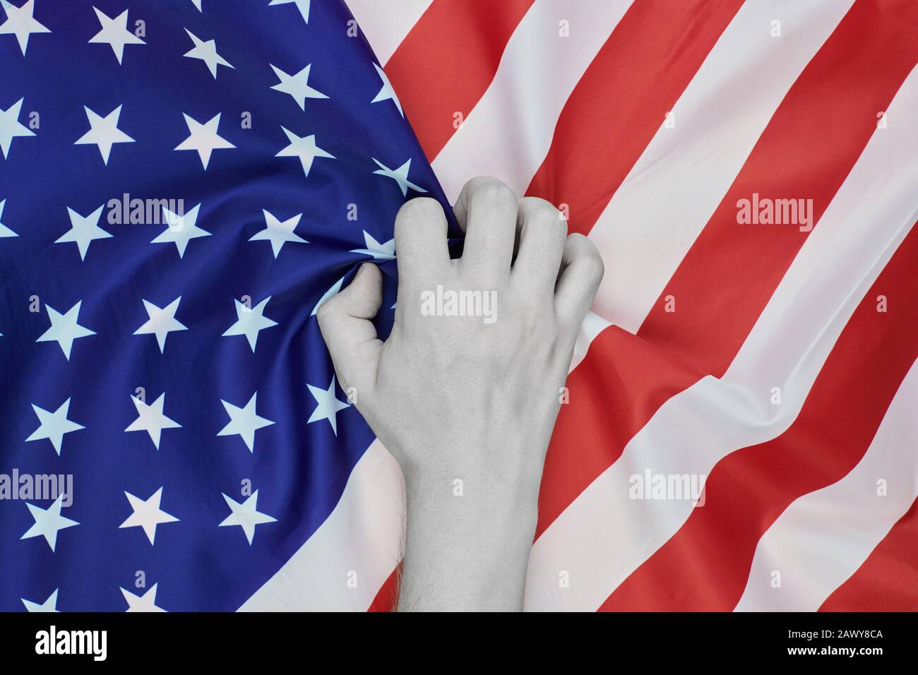 Colorless hand crumpled national USA american flag. Racism and white american discrimination