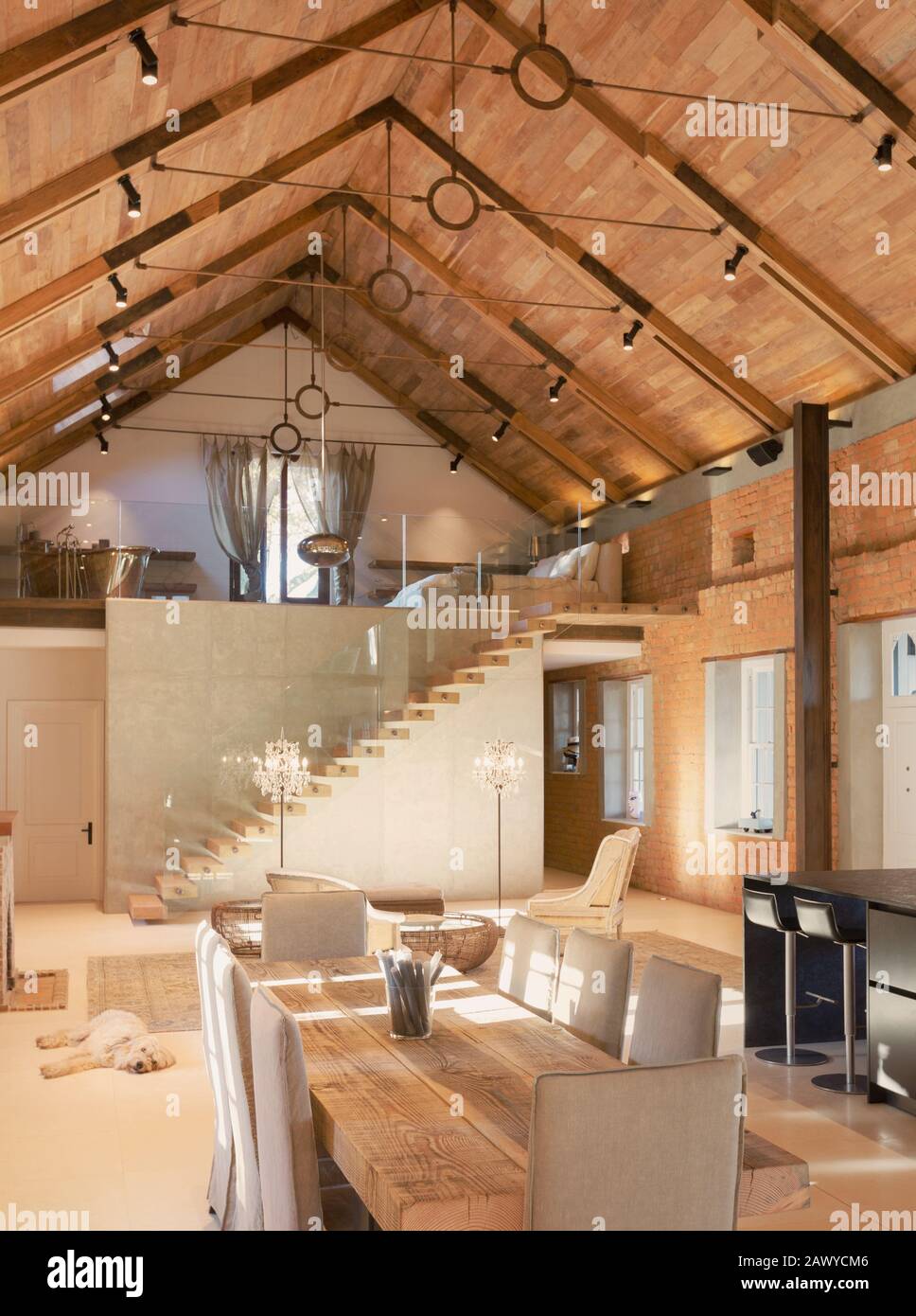 Home showcase interior dining room with wood vaulted ceiling and spiral