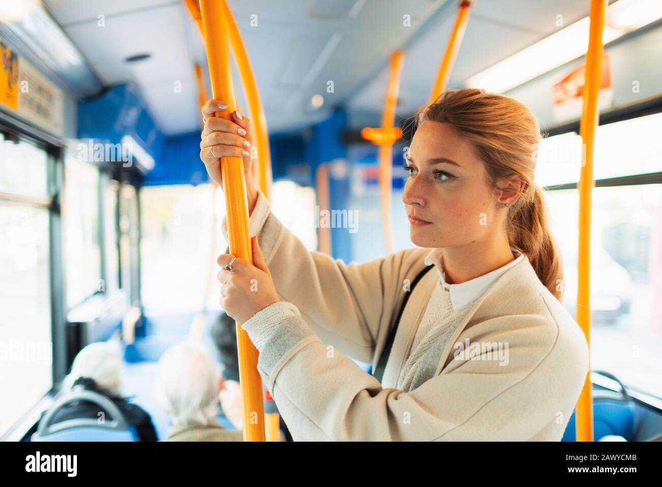 Young woman riding bus Stock Photo