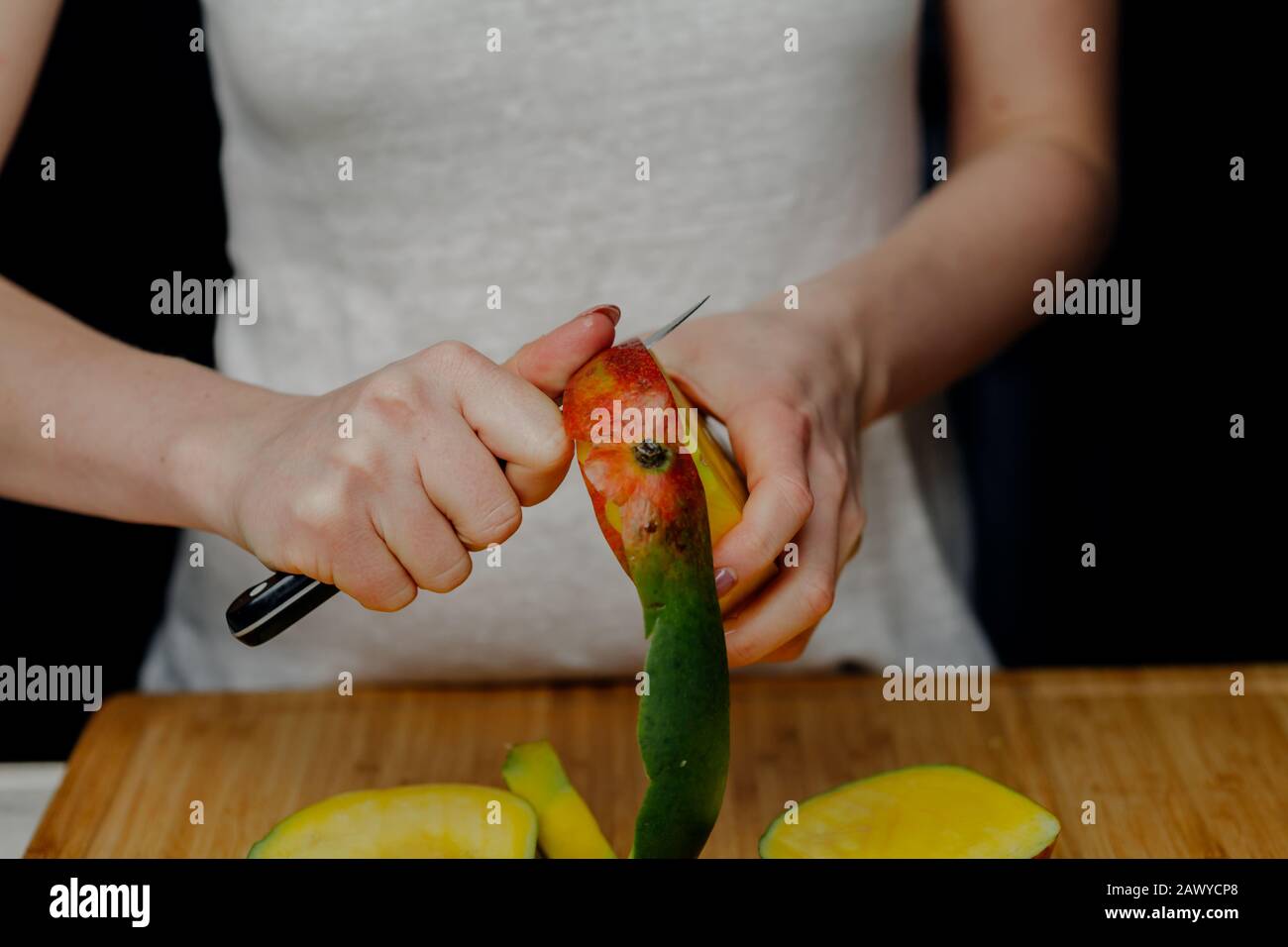 Woman Cutting Mango Fruit with Sharp Knife Stock Photo Alamy