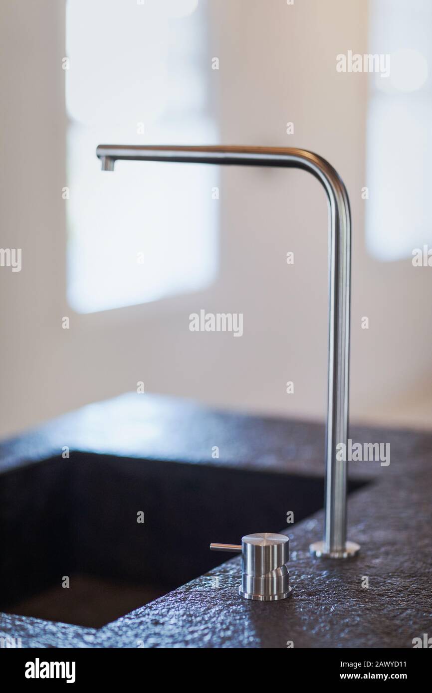 Modern kitchen sink faucet Stock Photo