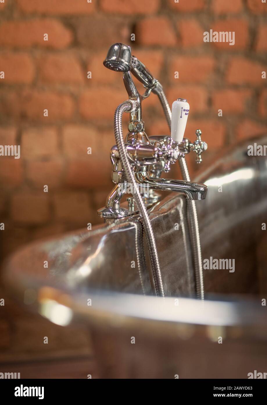 Home showcase interior stainless steel soaking tub faucet Stock Photo