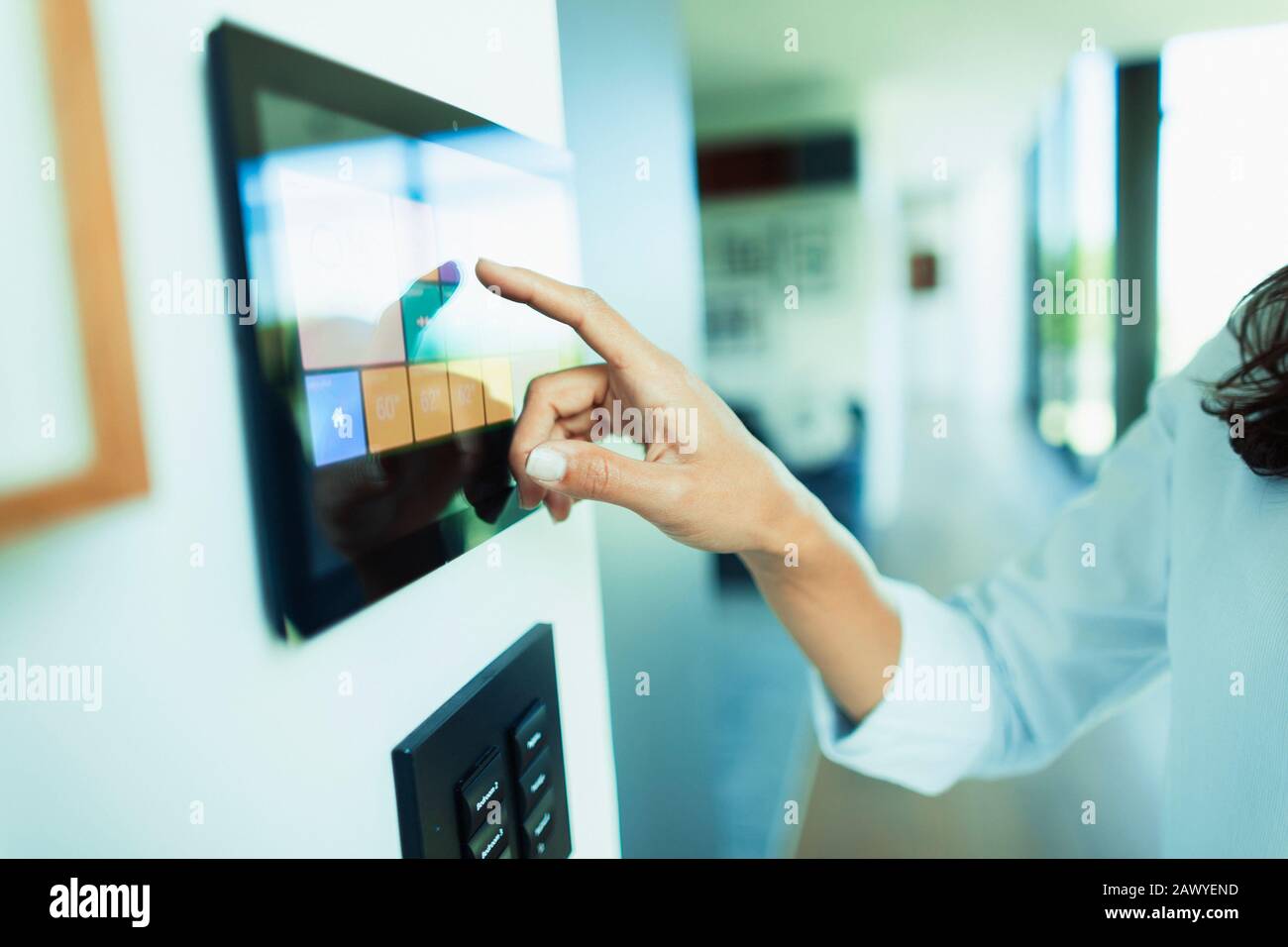 Close up woman at home automation touch screen panel Stock Photo