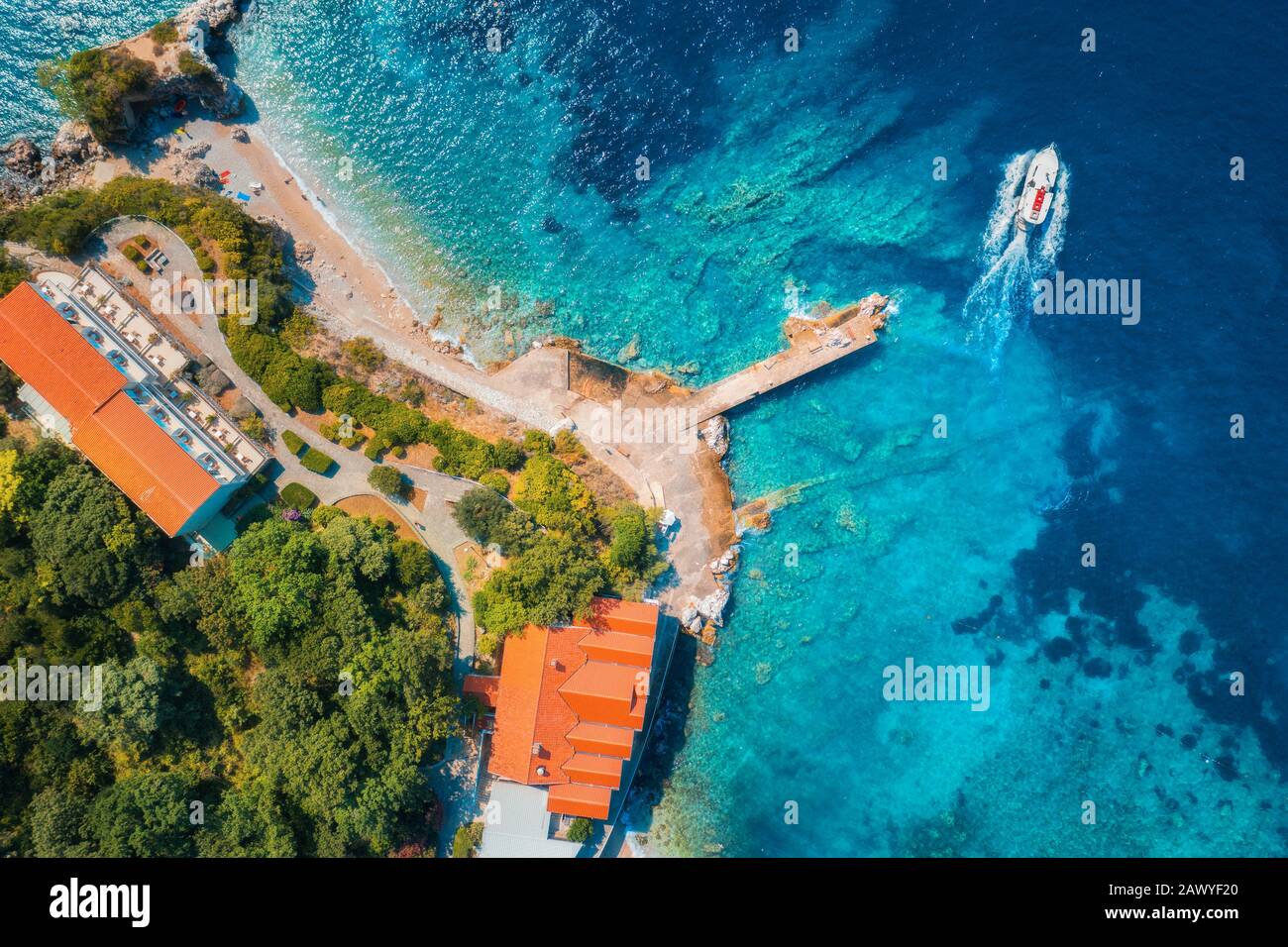 Aerial view of sea coast with clear blue water and boat Stock Photo - Alamy