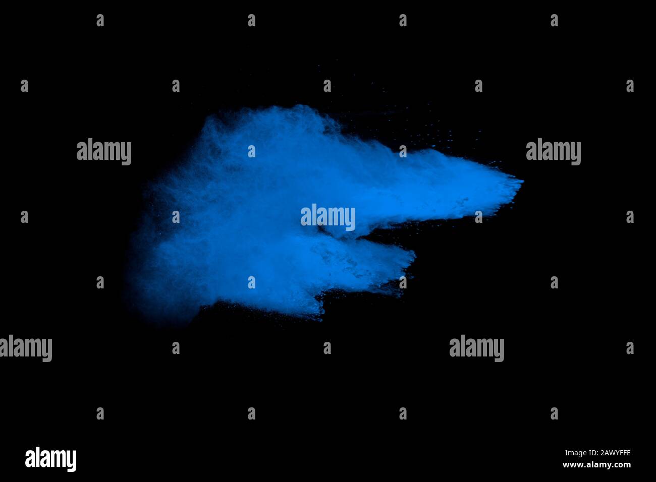 Blue color dust particles explosion cloud on black background.Color powder splash. Stock Photo