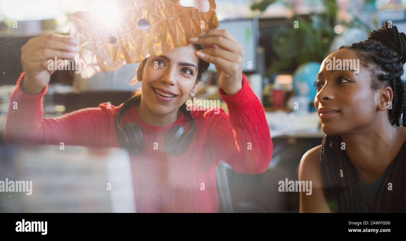 Female engineers examining prototype in office Stock Photo
