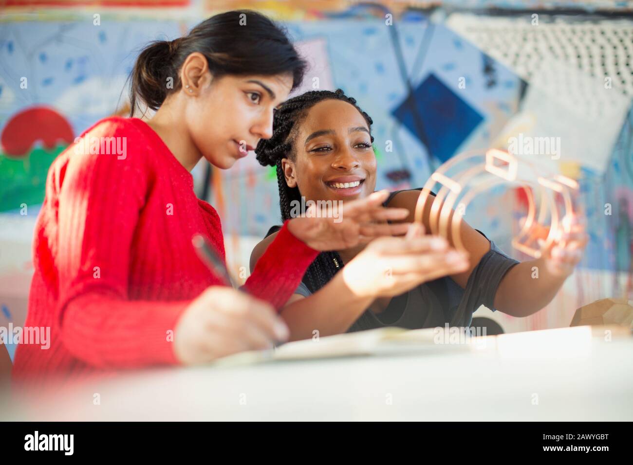 Female engineers examining prototype in office Stock Photo