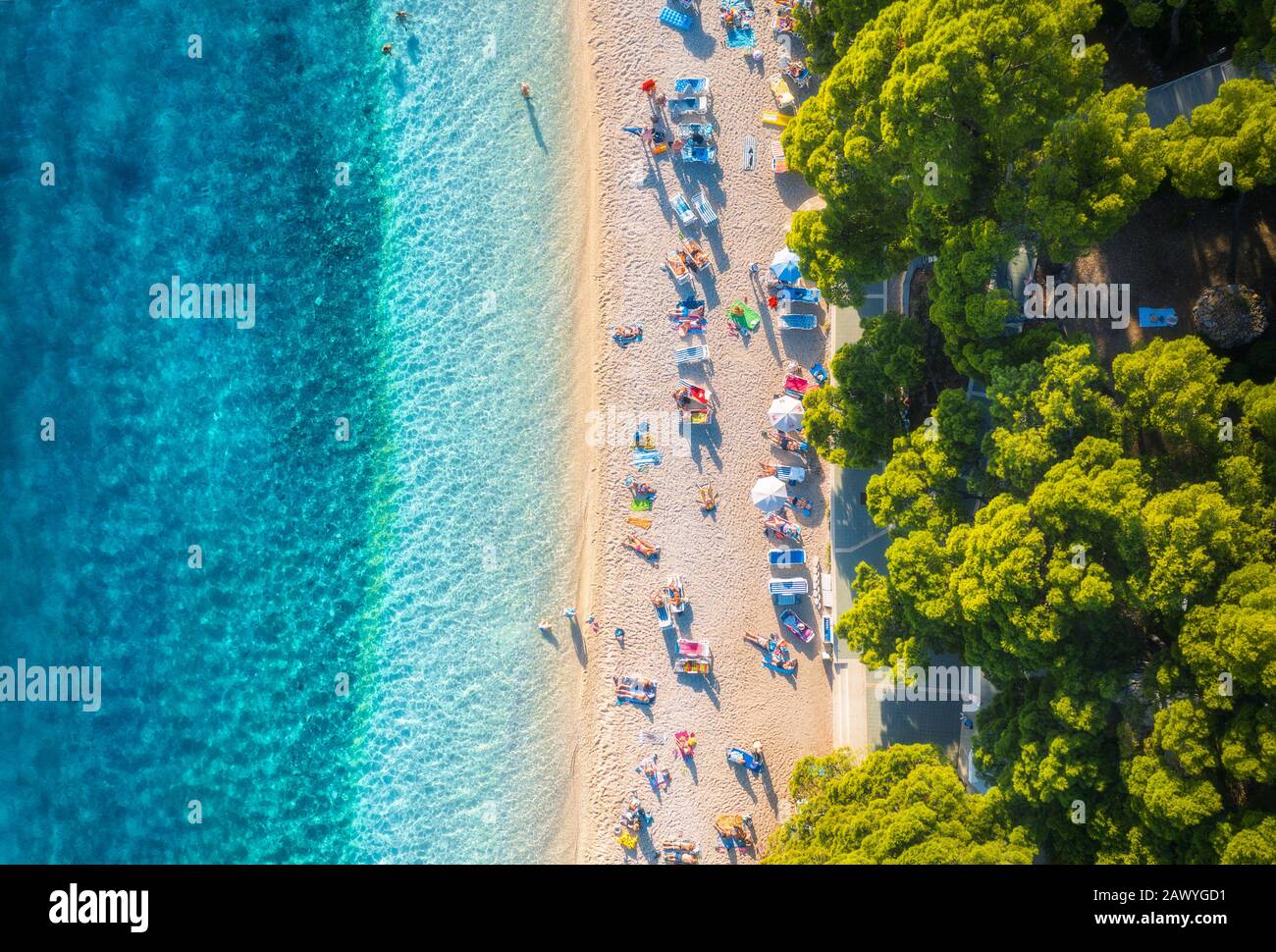 Aerial view of sandy beach with colorful umbrellas, blue sea sea Stock Photo