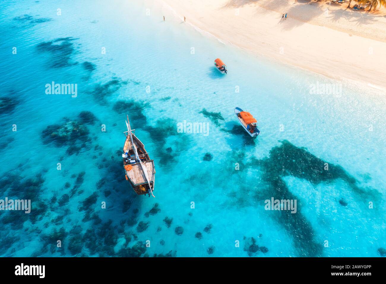 Aerial view of the fishing boats in clear blue sea at sunset Stock ...