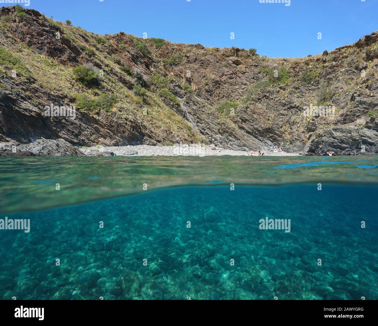 Spain Costa Brava, rocky beach near Portbou, split view over and under water surface, Mediterranean sea, Catalonia, Alt Emporda, Cala Pi Stock Photo