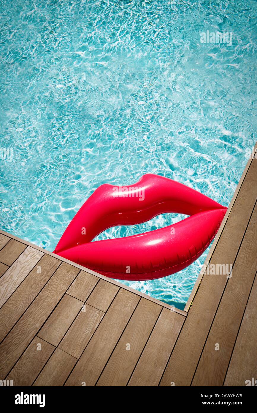 Inflatable lips in corner of sunny summer swimming pool Stock Photo Alamy