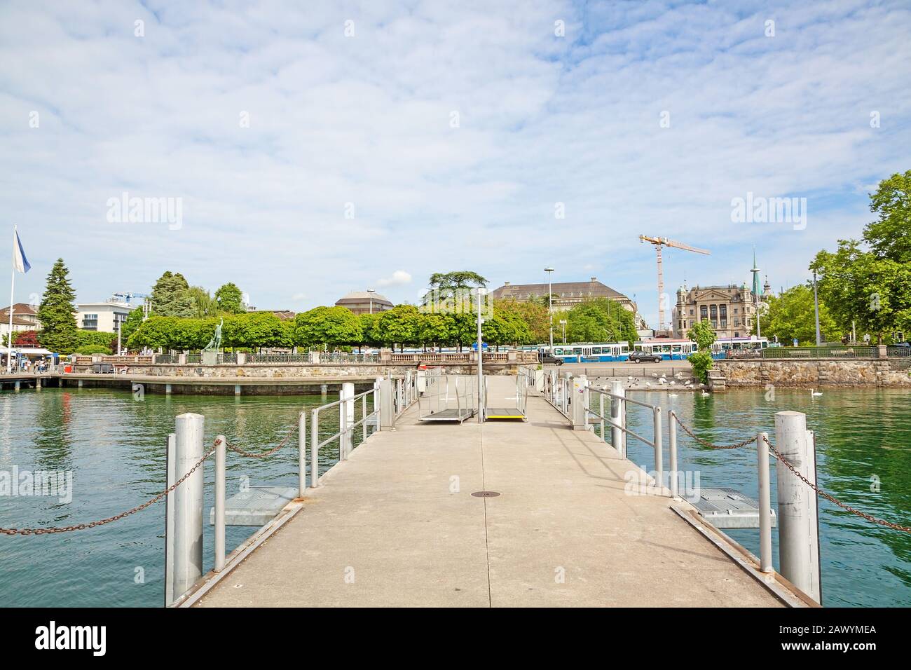 Zurich, Switzerland - June 10, 2017: Shipping pier at Burkliplatz, where excursion ships starts for boat trips over Lake Zurich and river Limmat. View Stock Photo