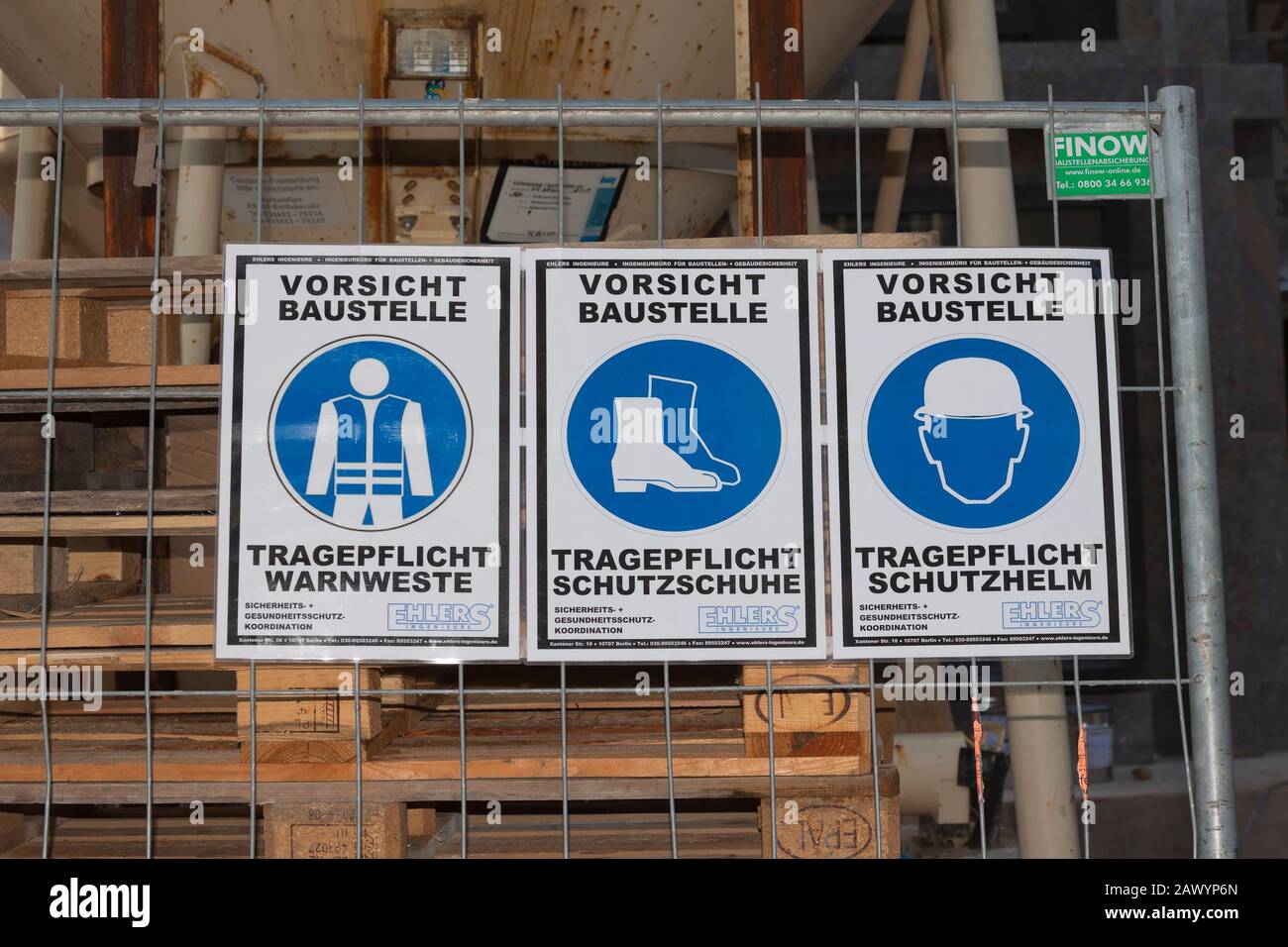 Caution construction site, mandatory wearing safety vest, protective vest, construction helmet, Berlin Stock Photo