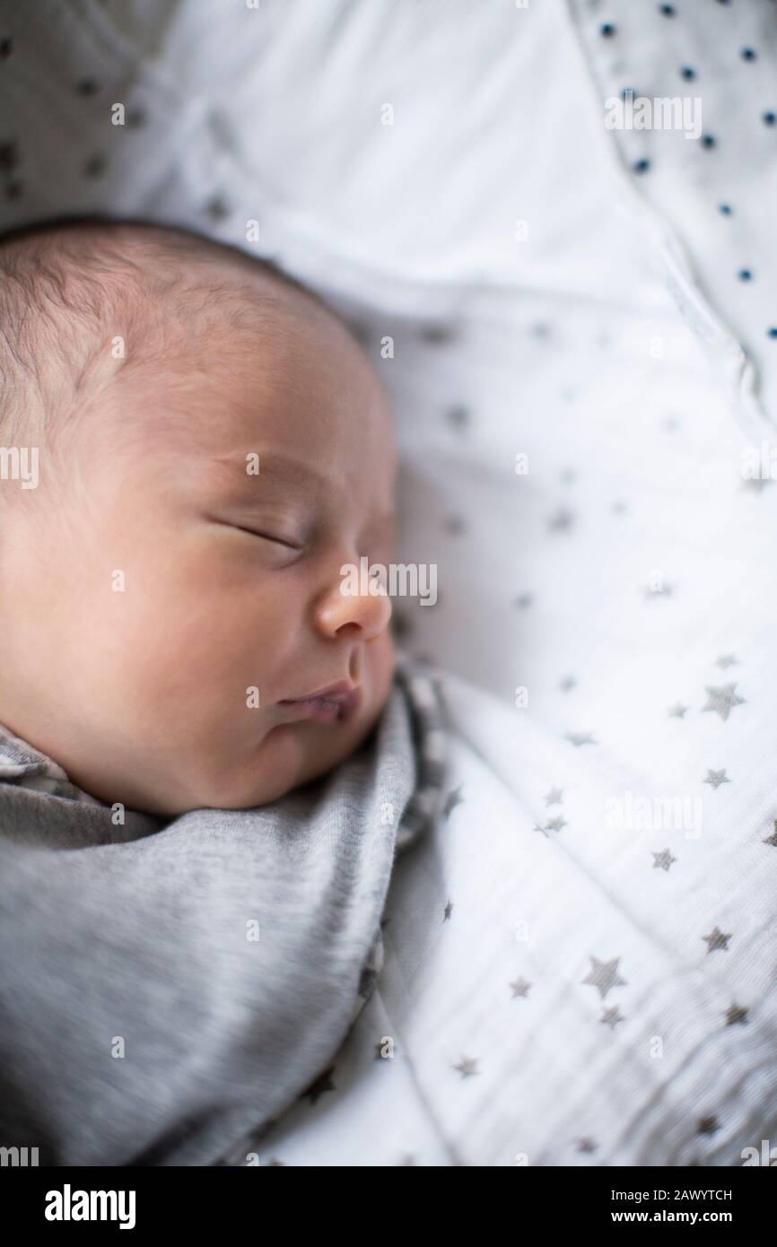 Tired newborn baby boy sleeping Stock Photo Alamy