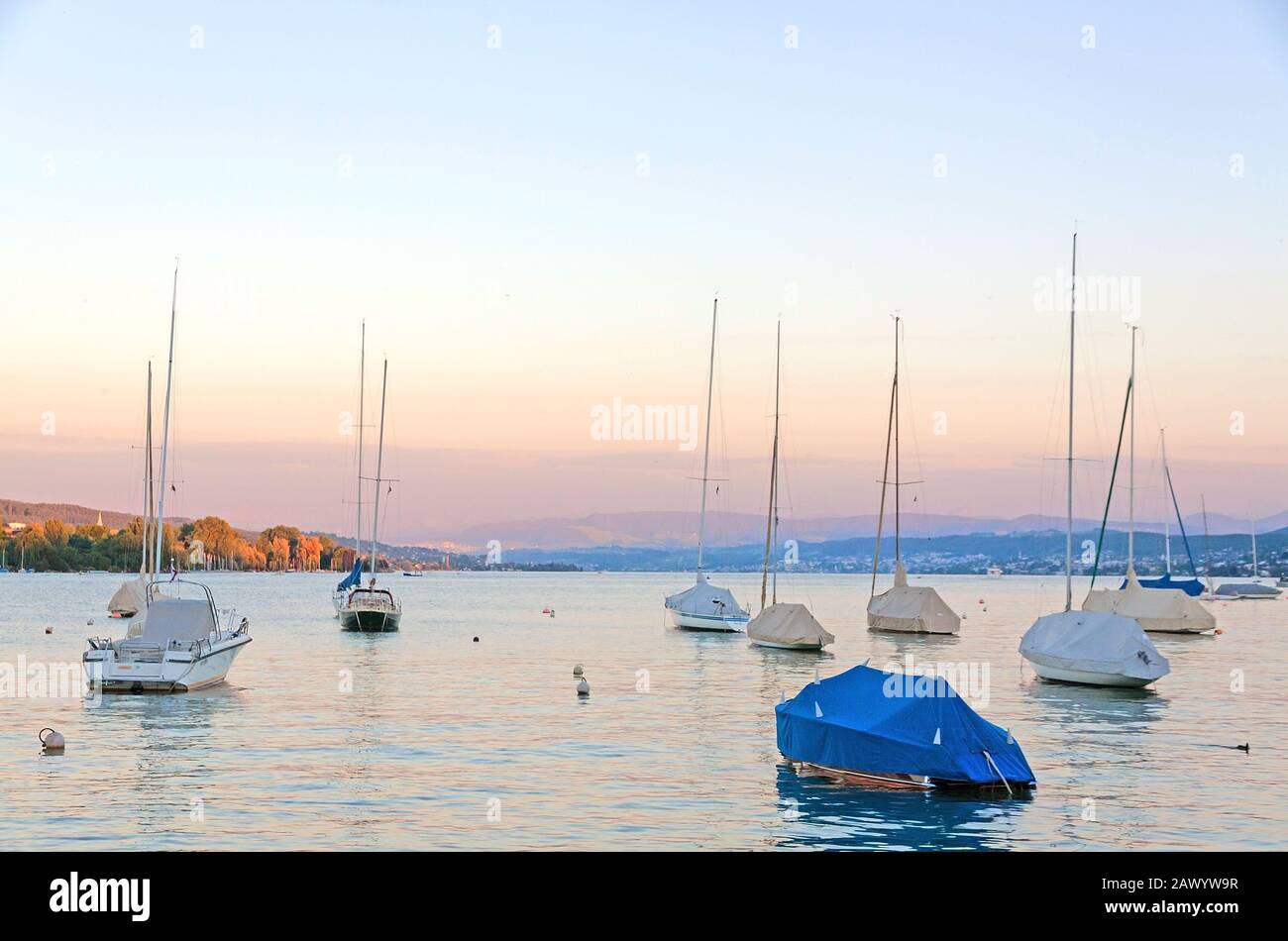 Lake Zurich (Zurichsee) at evening - boats in front Stock Photo