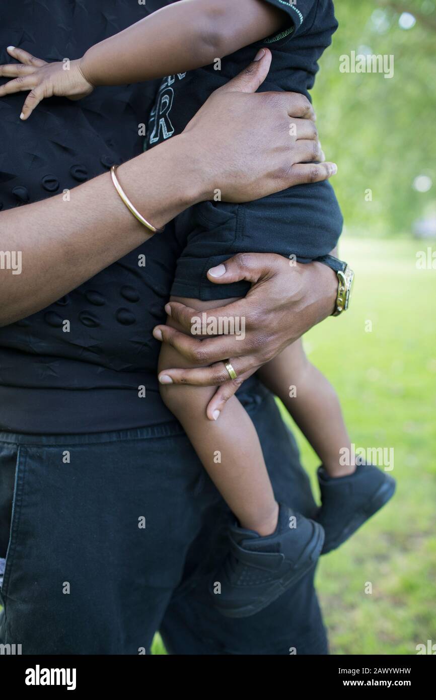 Father holding toddler son Stock Photo
