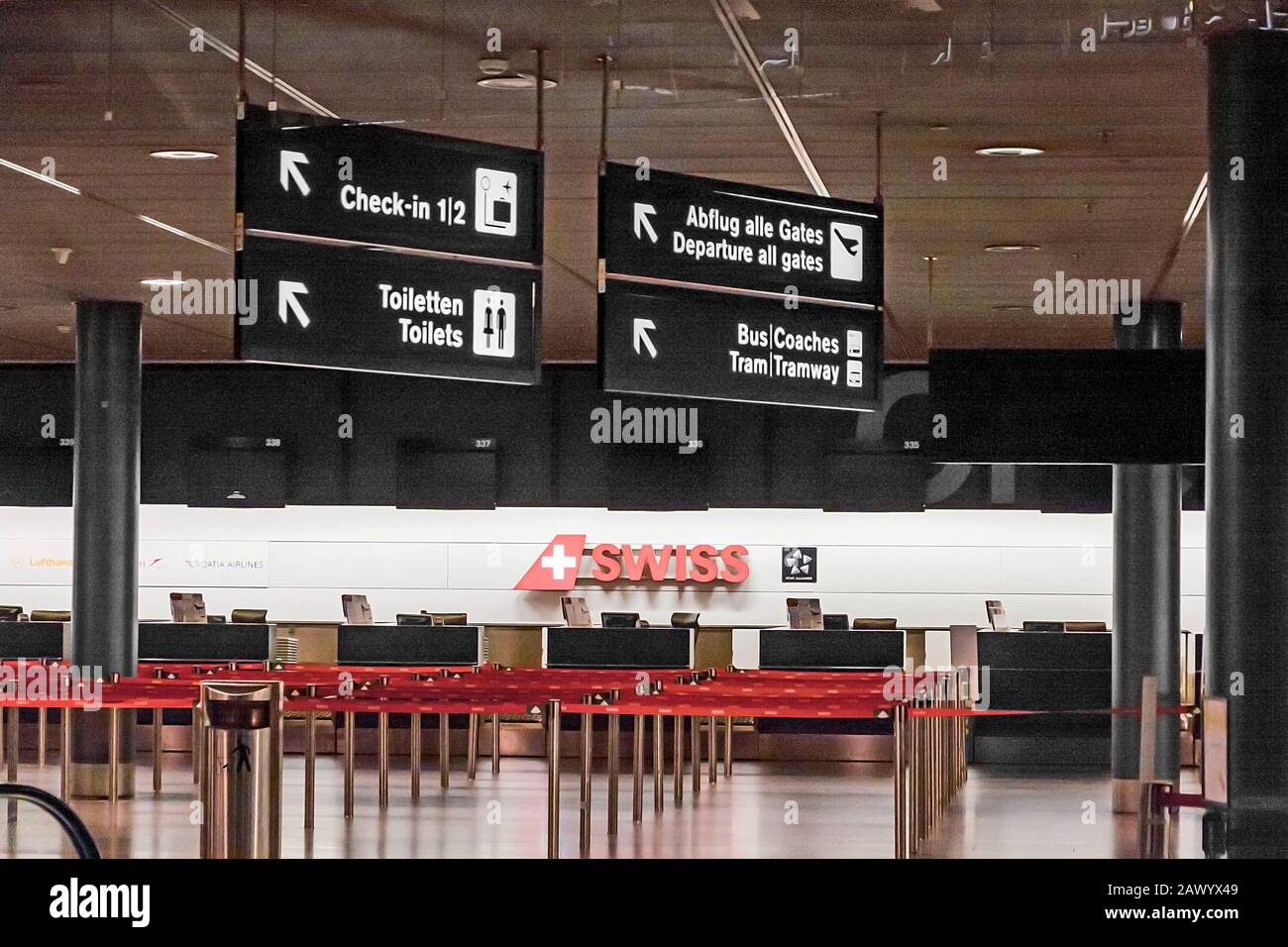 Zurich, Switzerland - June 11, 2017: Zurich airport, Check-in desk 3, sign to departure gates, tram, toilets Stock Photo