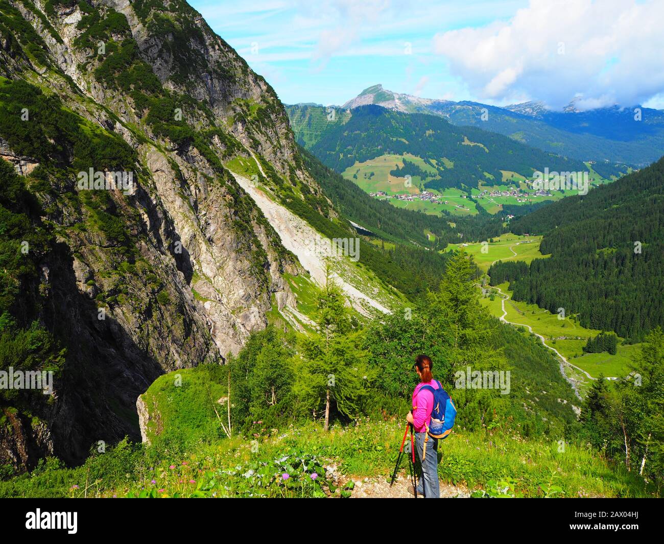 Girl walking in the Alps Stock Photo - Alamy