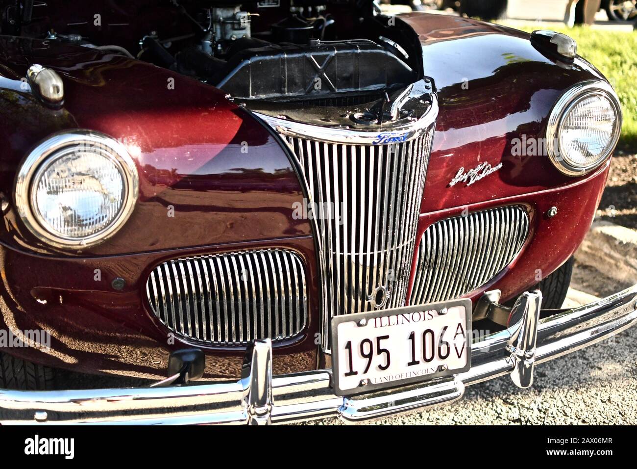 DOWNERS GROVE, UNITED STATES - Jun 07, 2019: A high angle shot of a shiny maroon vintage car Stock Photo