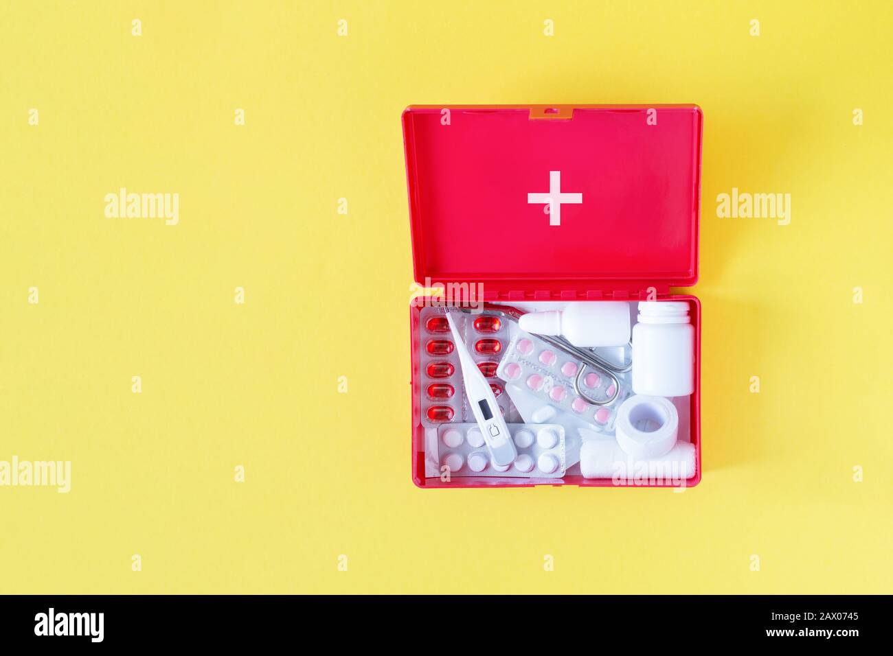 First aid kit red box with medical equipment and medications for ...